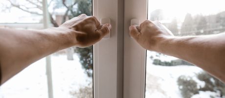The man opens the window. Wide angle first person view.